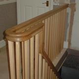 New open string staircase with oak continuous handrail